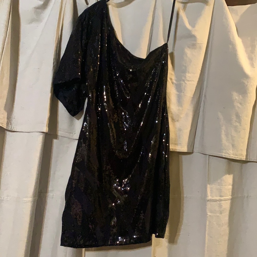 Black one sleeve sequin dress.